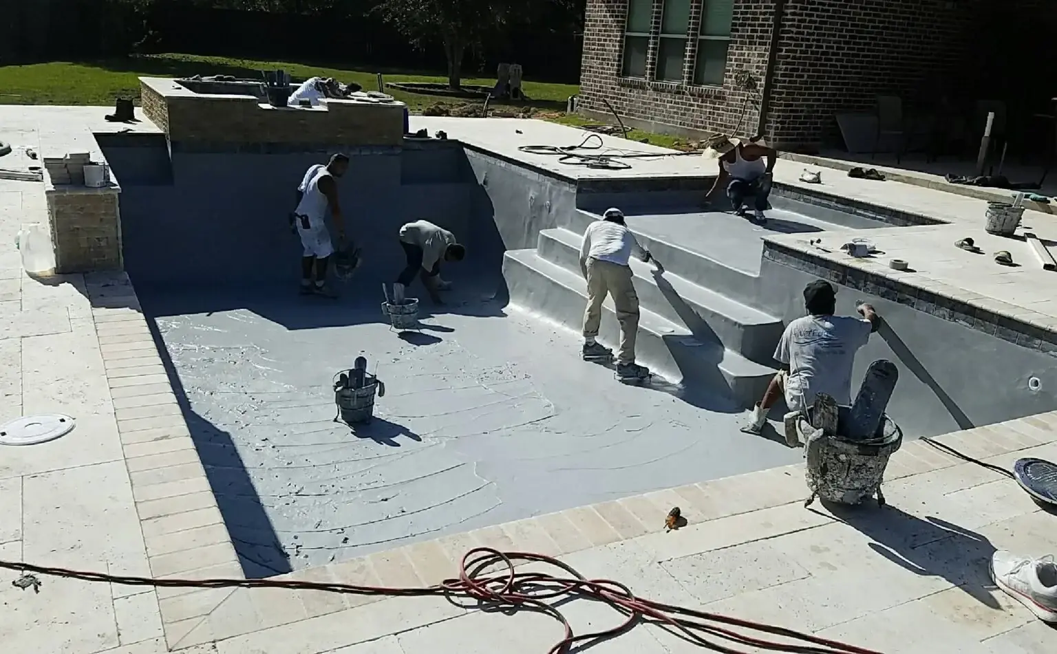 Clearwater crew applying an interior pool finish